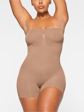SKIMS Seamless Sculpt Strapless Shortie Bodysuits in Sienna